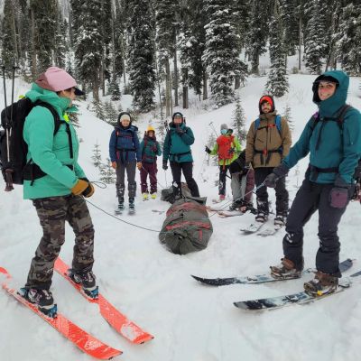 A group of skiers learning WAFA skills