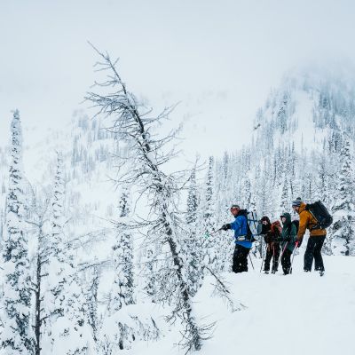 Guided group practicing avalanche rescue skills during an AST 1 course near Nelson, BC